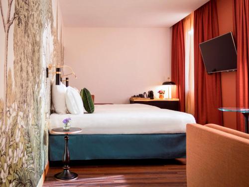 Säng eller sängar i ett rum på Hotel Mercure Roma Corso Trieste