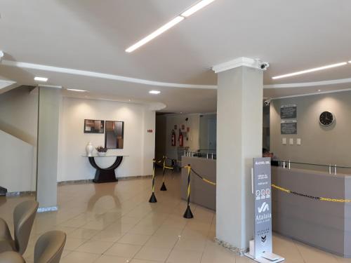 a lobby of a hospital with a waiting room at Atalaia Apart Hotel in Aracaju