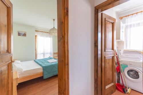 Un ou plusieurs lits dans un hébergement de l'établissement Casa Falcade