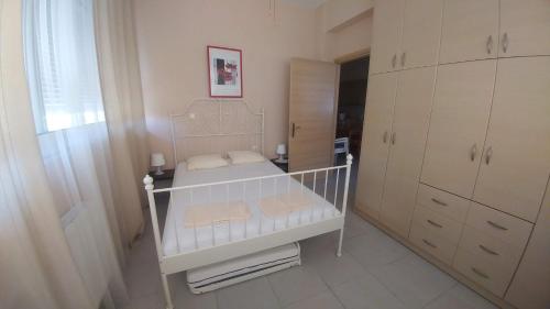 Ένα ή περισσότερα κρεβάτια σε δωμάτιο στο Family Apartment