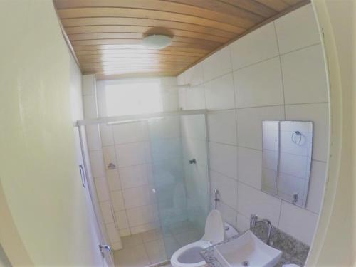 a bathroom with a shower and a toilet at Serena Morro in Morro de São Paulo