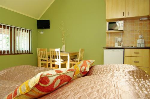 Cama ou camas em um quarto em Maja Apartman