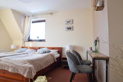 Ένα ή περισσότερα κρεβάτια σε δωμάτιο στο Willa Magnolia