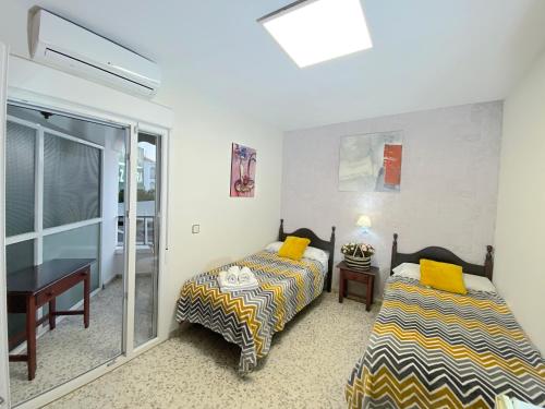 Postel nebo postele na pokoji v ubytování Hostal Azahara