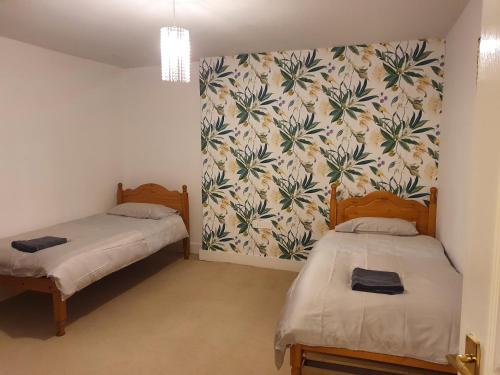 En eller flere senge i et værelse på Mariyka House