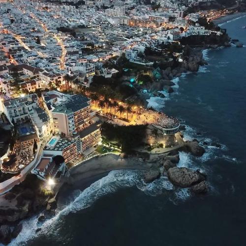 an aerial view of a city at night at Sunny Studio Nerja in Nerja