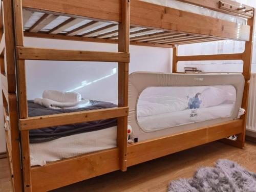 two bunk beds in a room with a mirror at Pale city center apartment in Pale