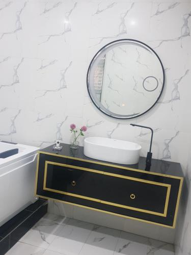 a bathroom with a sink and a mirror at Executive Home Extension in Lagos