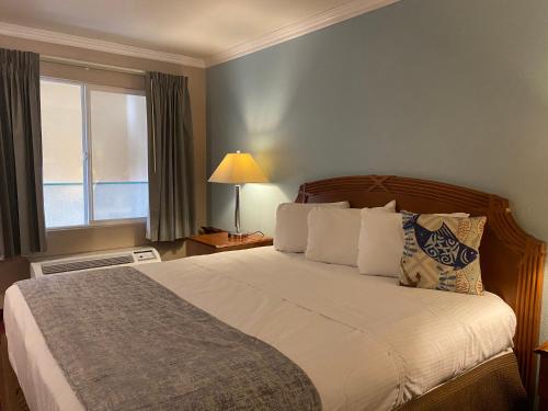 Кровать или кровати в номере Oceano Inn