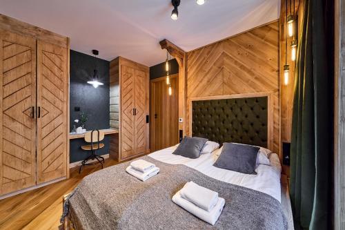 Aparthotel Giewontにあるベッド