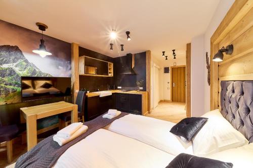 Aparthotel Giewontにあるベッド