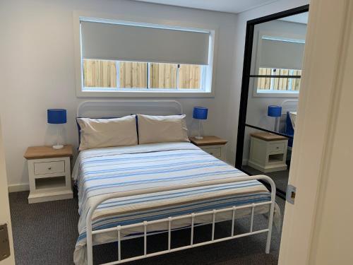 Postel nebo postele na pokoji v ubytování North Avoca - Superior Beach Flat