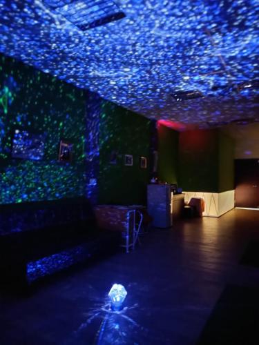 a living room with blue lights on the ceiling at 博愛泊旅讀心境 in Hualien City