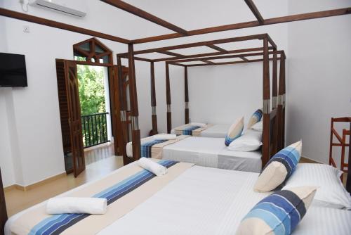 Кровать или кровати в номере Double Lake View Tissa & Safari