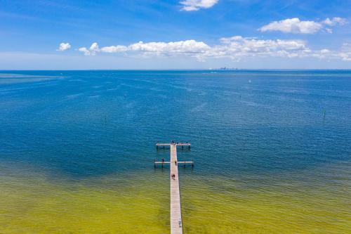 a wooden pier in the middle of the water at The Blue Lagoon in Ruskin