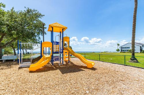 a playground with a slide in a park at The Blue Lagoon in Ruskin