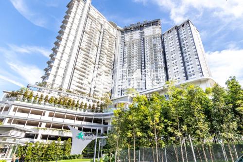 a large white building with trees in front of it at Windmill Upon Hills Premium Suites Genting Highland in Genting Highlands