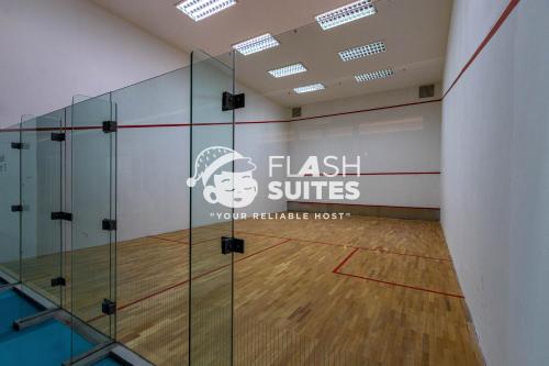 a gymnasium with a glass volleyball court at Windmill Upon Hills Premium Suites Genting Highland in Genting Highlands