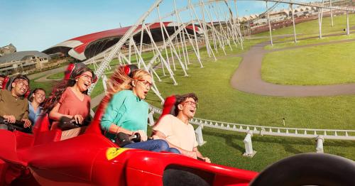 a group of people riding on a roller coaster at Radisson Blu Hotel, Abu Dhabi Yas Island in Abu Dhabi