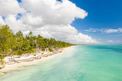 an aerial view of a beach with palm trees and the ocean at TUI BLUE Bahari Zanzibar in Pwani Mchangani