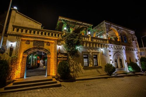 an entrance to a building at night at Stone House Cave Hotel in Goreme