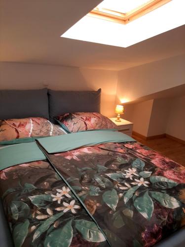 a bedroom with two beds in a attic at Red Rose Apartment in Portorož