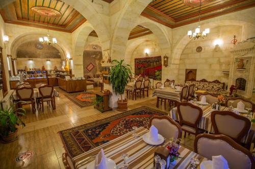 an overhead view of a restaurant with tables and chairs at Stone House Cave Hotel in Goreme