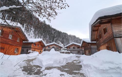 a row of buildings covered in snow next to buildings at Nice Home In Bartholomberg With Kitchen in Bartholomäberg