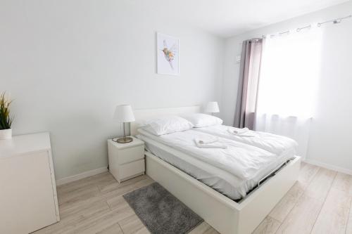 Posteľ alebo postele v izbe v ubytovaní Apartament 5k Nautica Szczecin