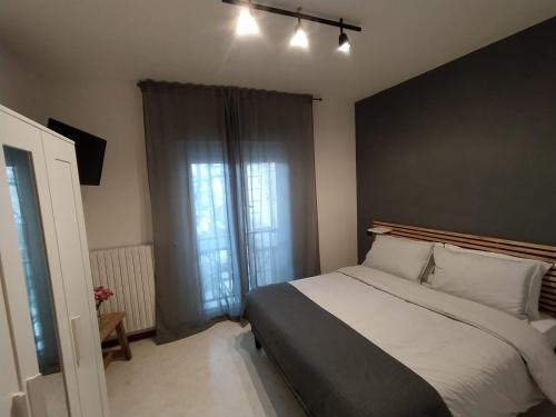 Ένα ή περισσότερα κρεβάτια σε δωμάτιο στο De Dominici's House
