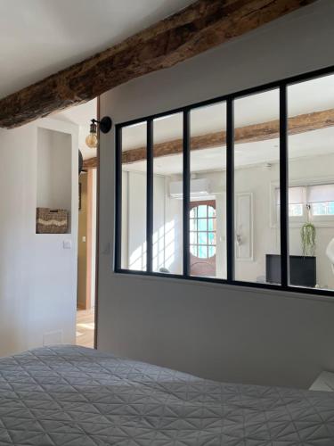 a bedroom with a large mirror on the wall at Cosy grand Studio in Roquebrune-sur-Argens