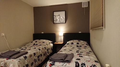 Postel nebo postele na pokoji v ubytování Chalet Op De Veluwe # Beuk