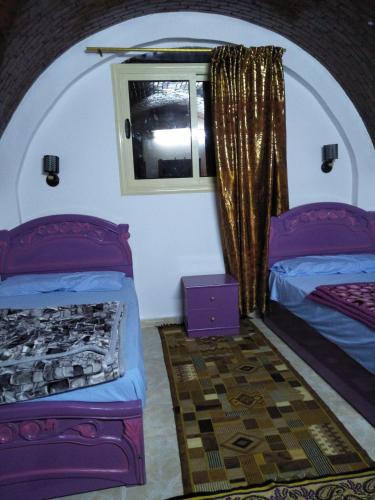 Ένα ή περισσότερα κρεβάτια σε δωμάτιο στο El Prince Guesthouse