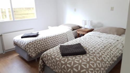 Postel nebo postele na pokoji v ubytování Chalet Op De Veluwe # Linde