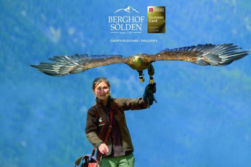 a man is holding an eagle on his arm at Berghof Sölden - anno 1588 in Sölden