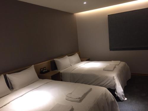 เตียงในห้องที่ Michi Hotel - Zhongli
