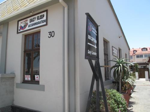 a sign on the side of a building at Eazy Sleep Accommodation in Swakopmund