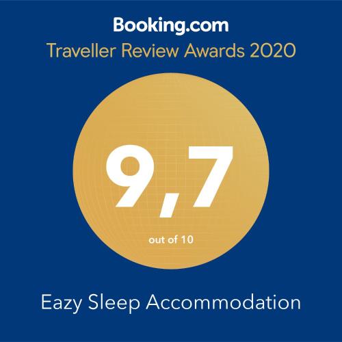 a yellow circle with the number seventy seven on it at Eazy Sleep Accommodation in Swakopmund