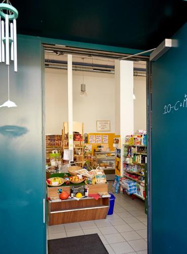 a grocery store aisle with a counter in a store at Wesenufer Hotel & Seminarkultur an der Donau in Wesenufer