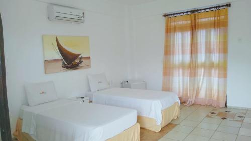 Giường trong phòng chung tại Hotel Pousada Summer Way