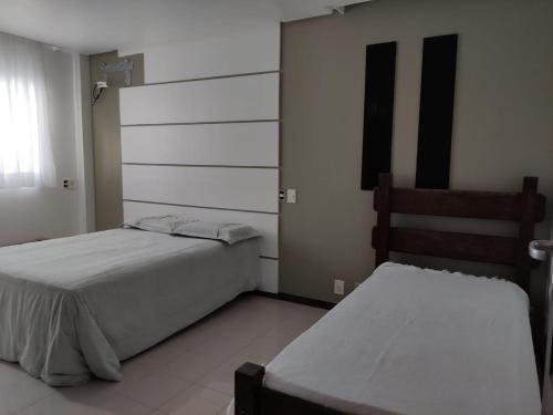 Tempat tidur dalam kamar di Casa Vilas do Atlântico, 3 quartos próximo a praia