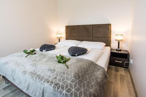Posteľ alebo postele v izbe v ubytovaní Apartament Wrzosowy - 5D Apartamenty