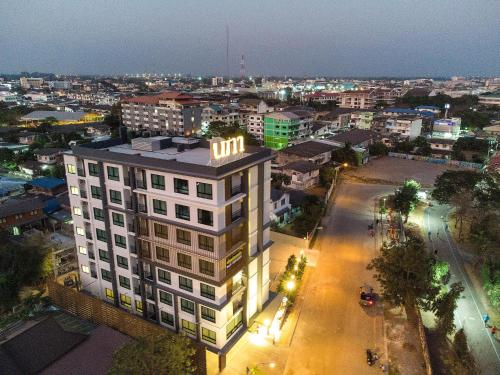 an overhead view of a building in a city at night at Napa Hotel Ratchaburi in Ratchaburi