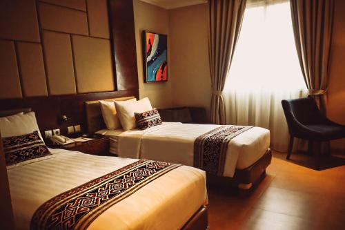 Tempat tidur dalam kamar di SOTIS Hotel Kemang, Jakarta