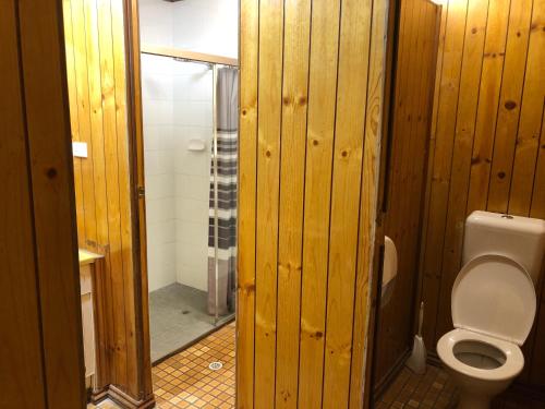 a wooden bathroom with a toilet and a shower at Commercial Hotel Morgan in Morgan