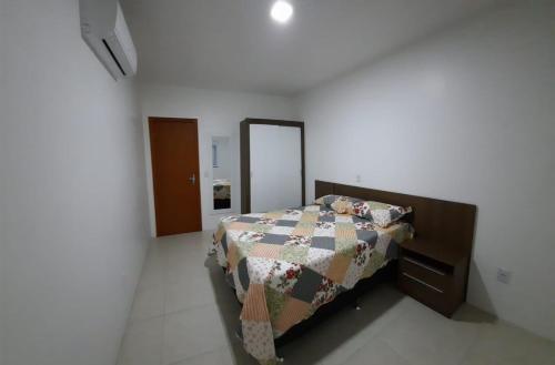 Katil atau katil-katil dalam bilik di Caminho de Garopaba