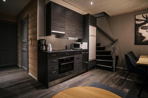 Kuchyň nebo kuchyňský kout v ubytování Levi Black Apartments