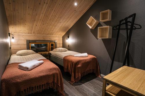 Postel nebo postele na pokoji v ubytování Levi Black Apartments