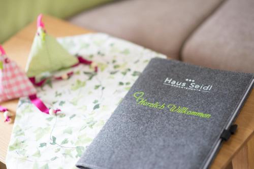 a book sitting on top of a table at Haus Seidl in Bodenmais