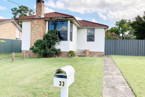 a parking meter in front of a house at Fieldsend Cottage in East Maitland